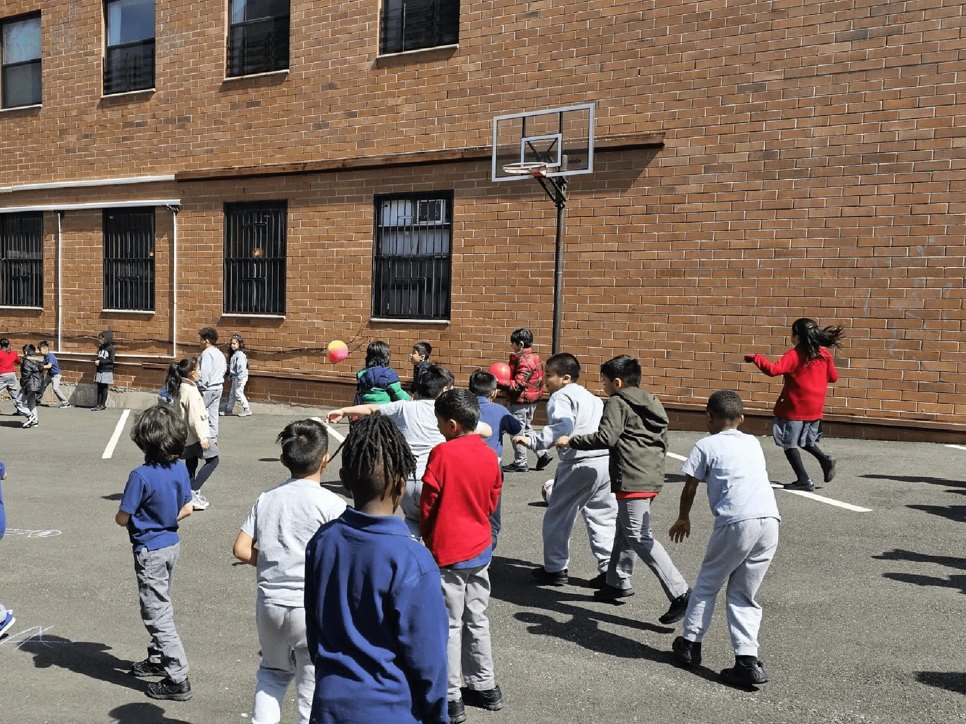 A-children-playing-in-basket-ball-area A children playing in basket ball area